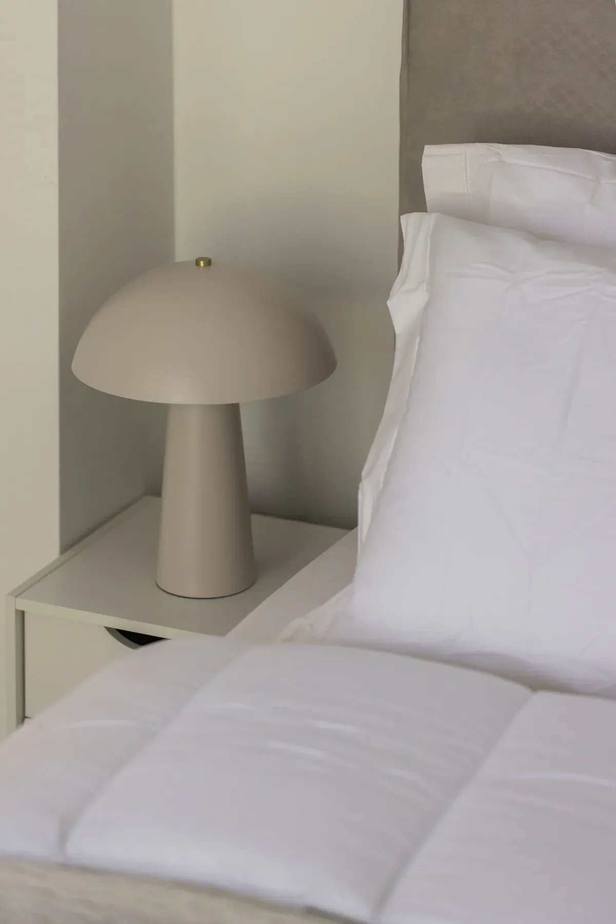 Bedside lamp and soft bedroom details