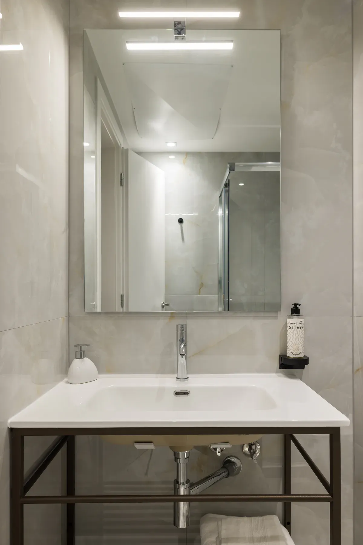 Bathroom vanity and illuminated mirror