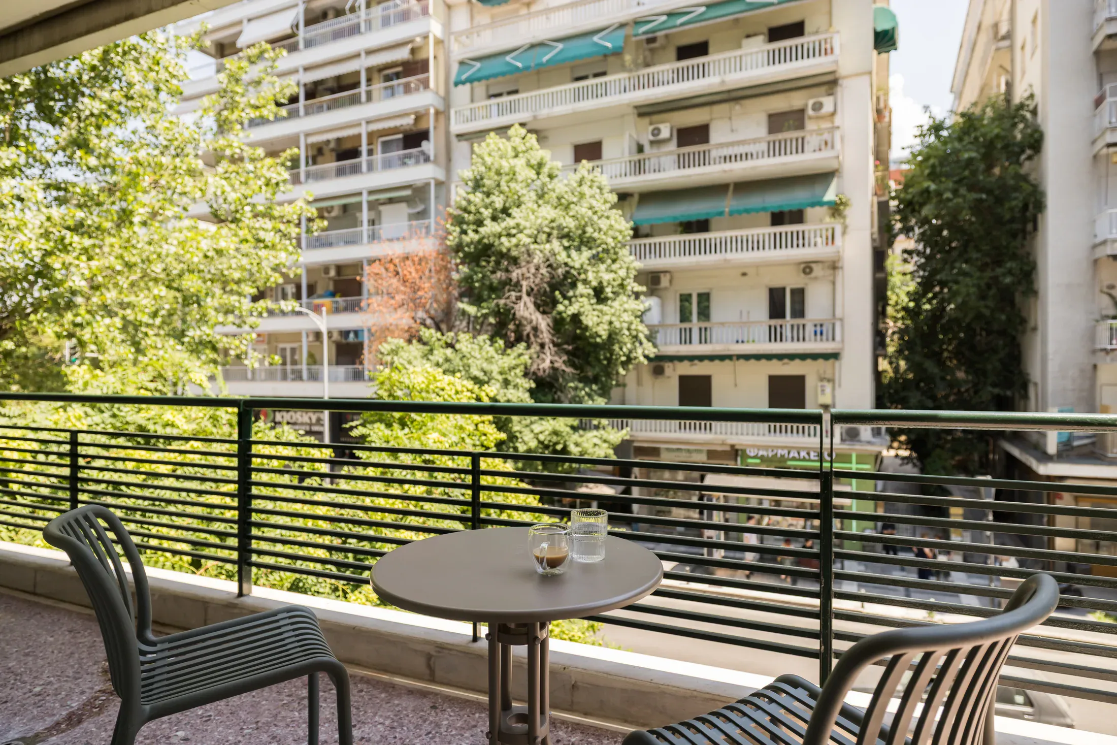 Private balcony with an outdoor table and chairs