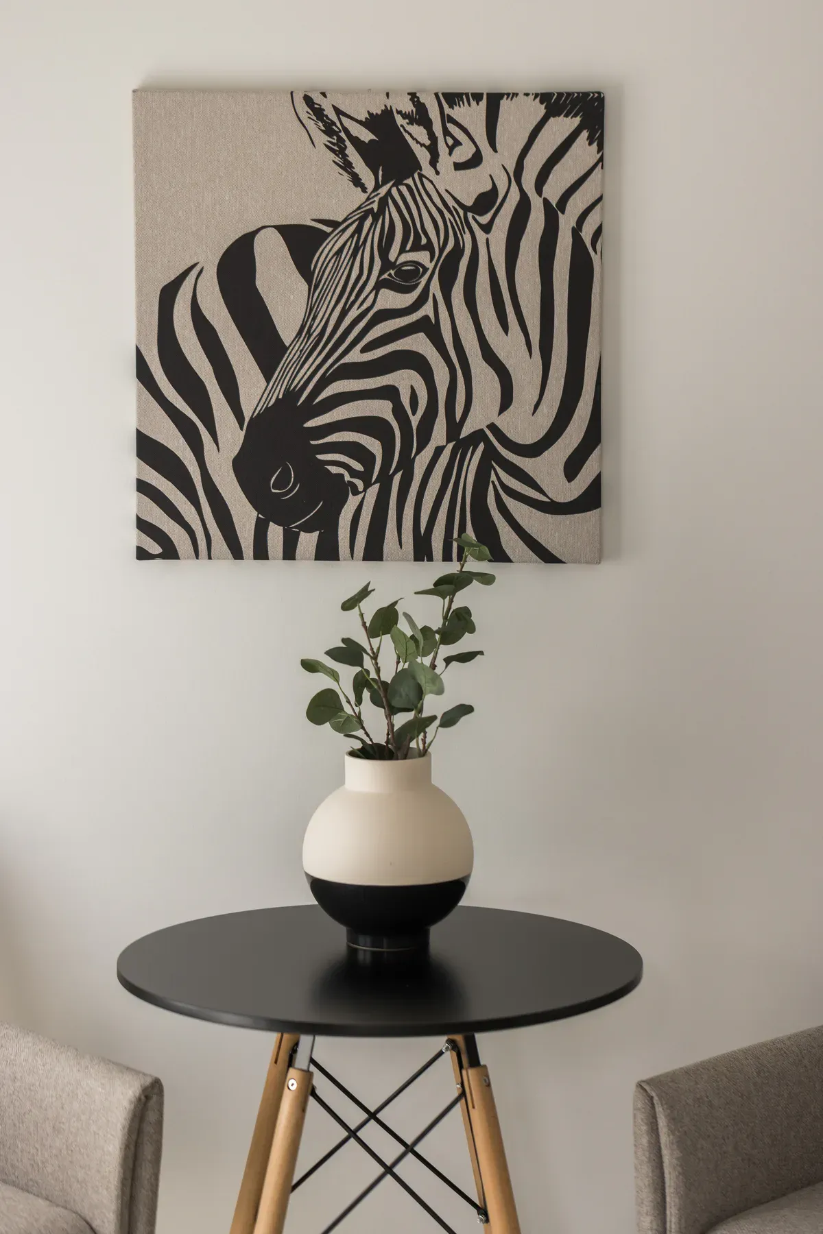 Zebra artwork and plant in the living room