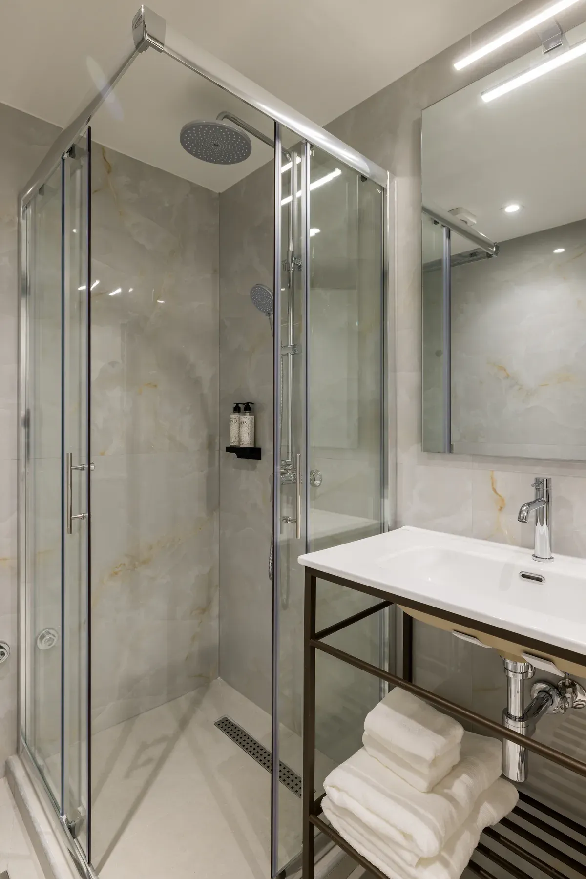Bathroom vanity beside the private balcony doors