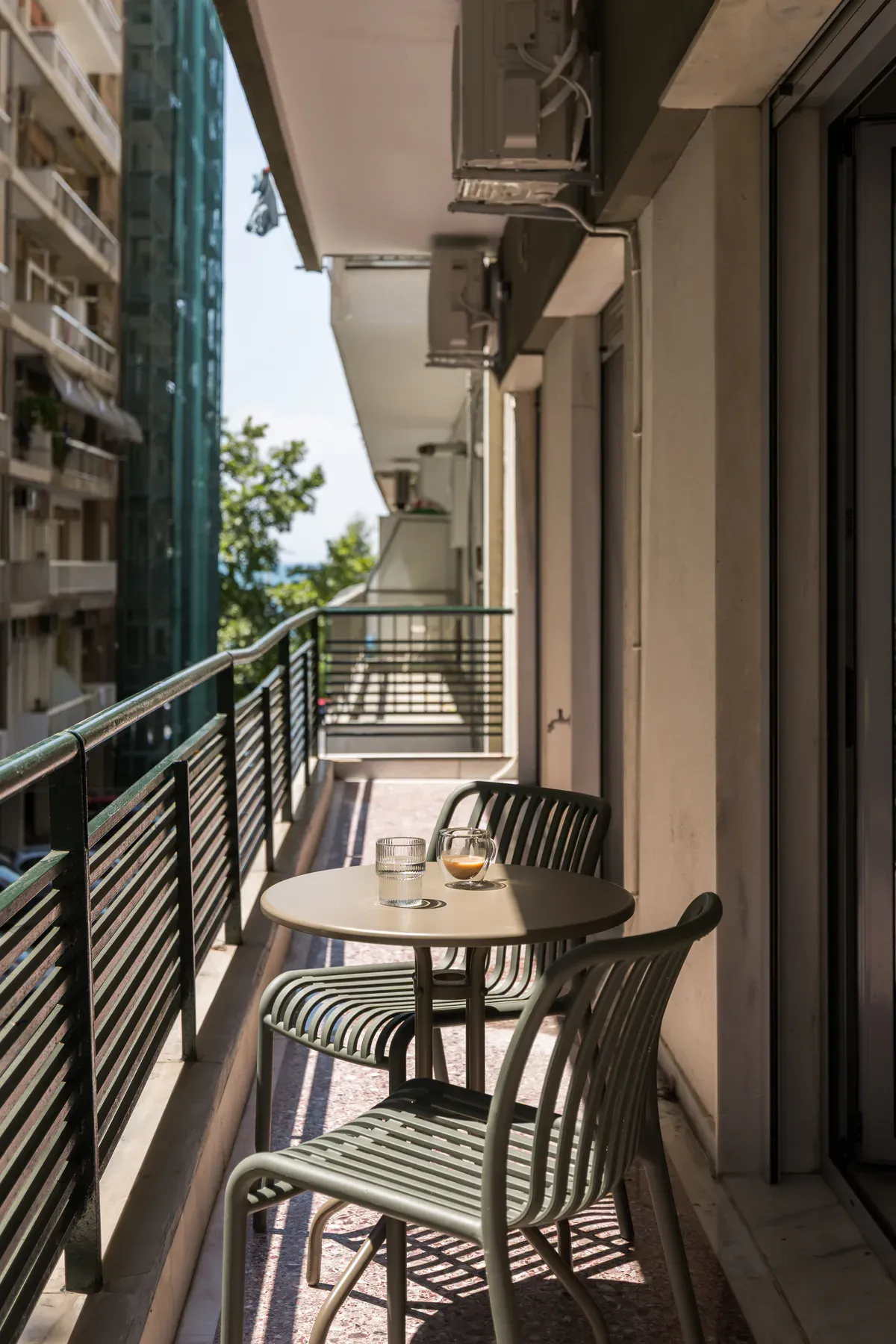 Private balcony with table and neighbourhood view
