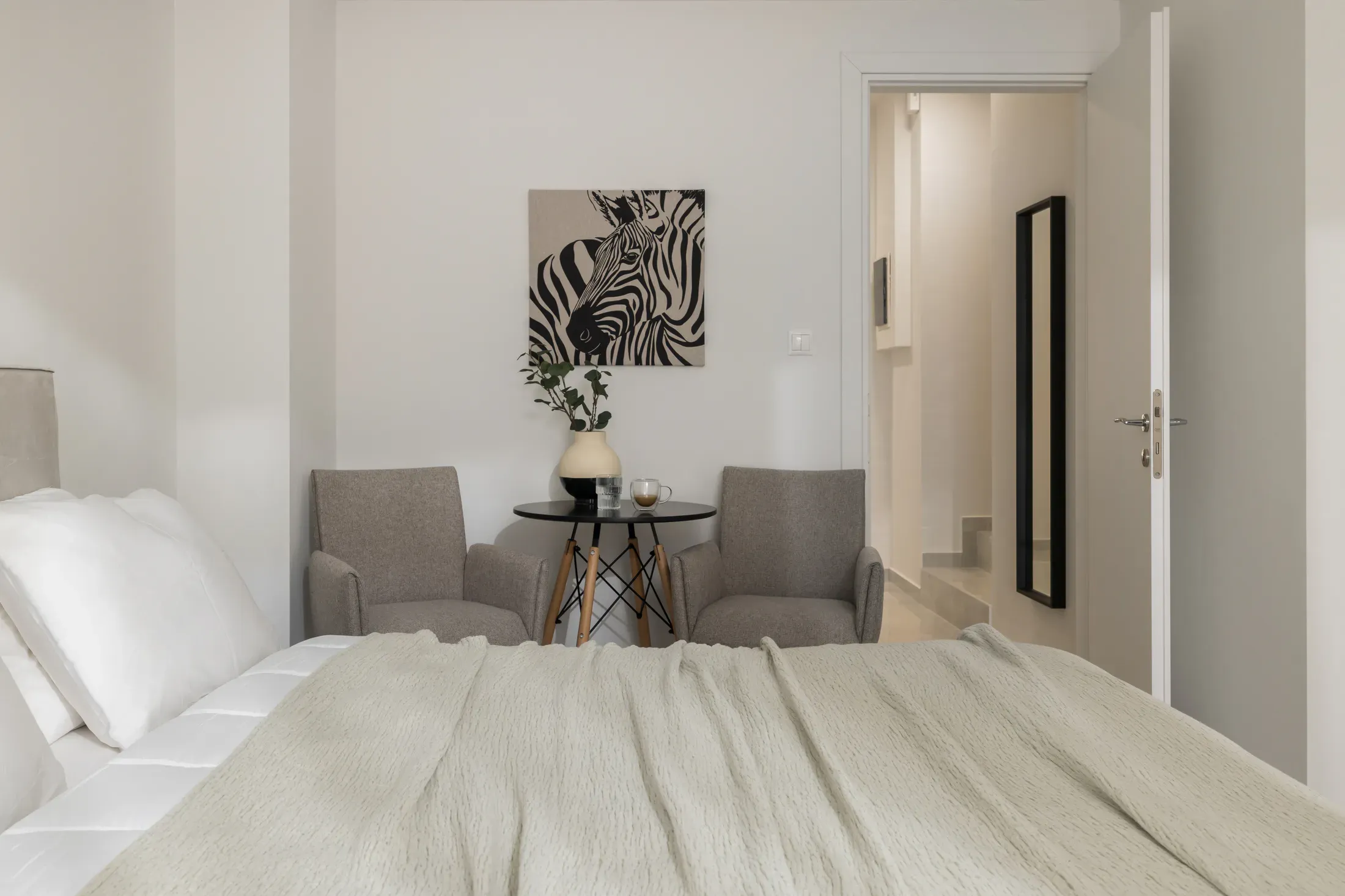 Bedroom with a small table and chairs